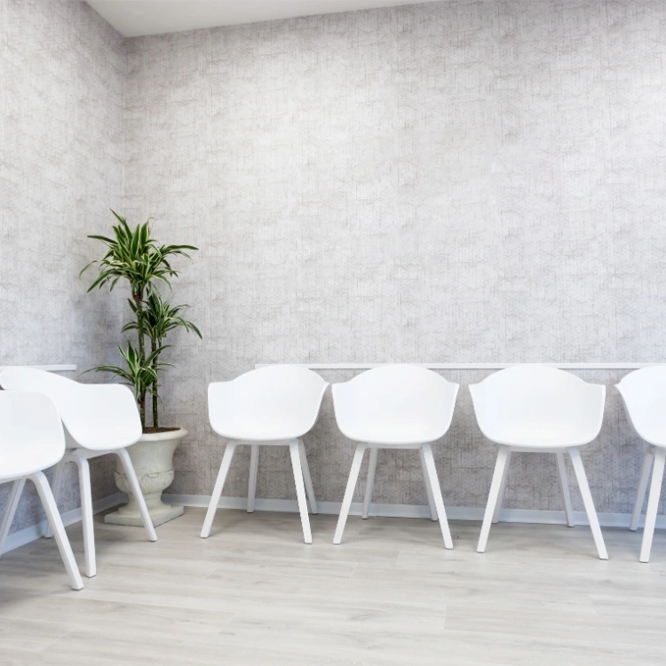 waiting room interior with white chairs